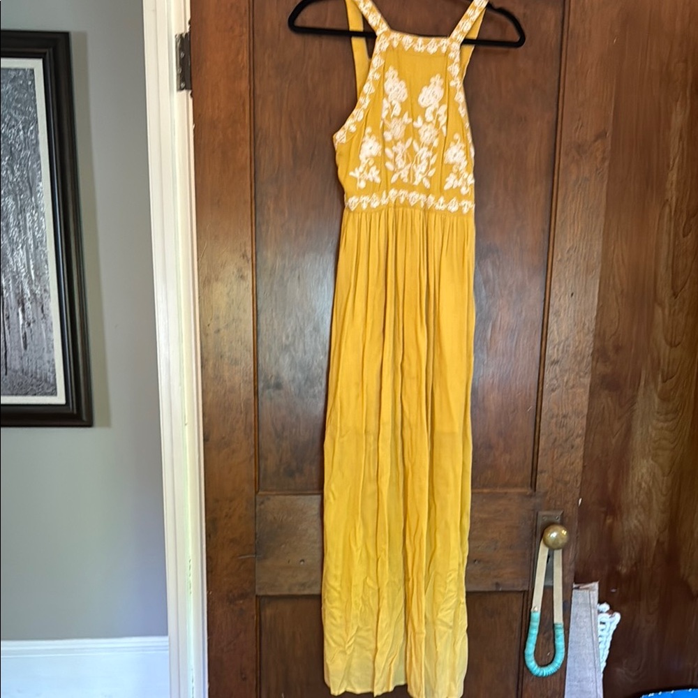 Golden maxi dress with white embroidery